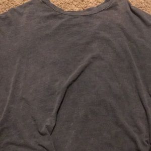 a ruffled gray shirt